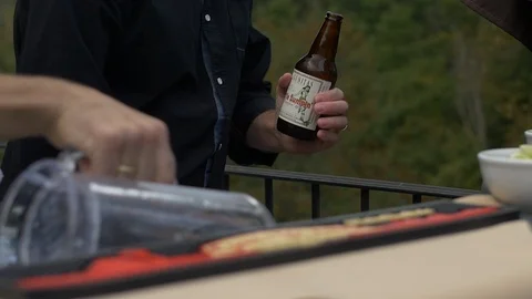 Outdoor Bartender opens a Beer Stock Footage 89503461