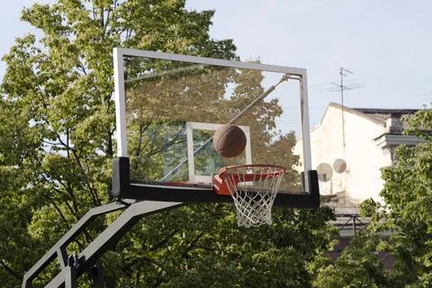Outdoor Basketball hoop and ball. Selective focus. Stock Photos