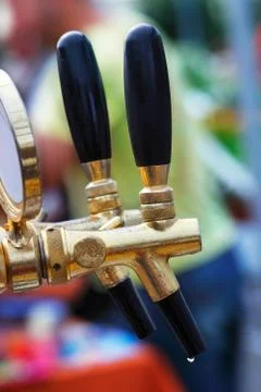 Outdoor beer tap array with drop Stock Photos