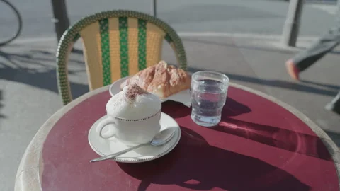 Outdoor breakfast Experience at a Sidewalk Café on a Bright Day Stock Footage 328342682