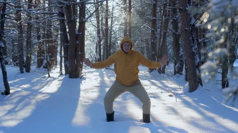 Outdoor breathing exercise practice in snowy winter forest Stock Footage 334328555