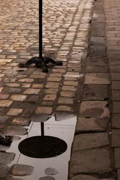 Outdoor Cafe Table Reflected in a Rain Puddle. Stock Photos