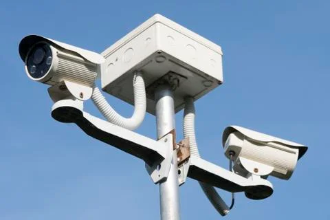 Outdoor CCTV Camera Operating for security in garden , on blue sky background Stock Photos