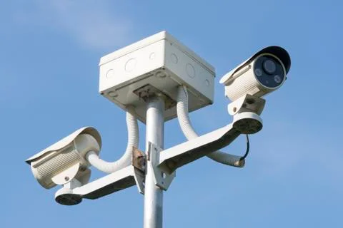 Outdoor CCTV Camera Operating for security in garden , on blue sky background Stock Photos