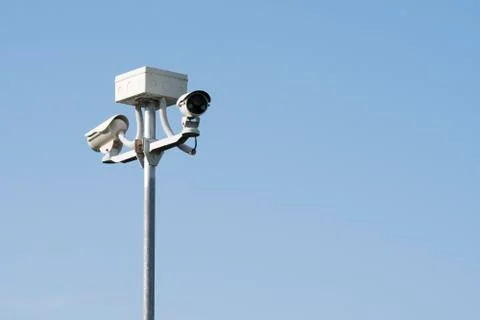 Outdoor CCTV camera security system, on blue background 스톡 사진