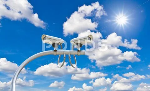 Outdoor cctv cameras against blue sky and sunshine Stock Photos