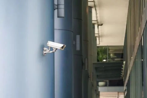 Outdoor CCTV Security camera installed on the building in the city Stock Photos