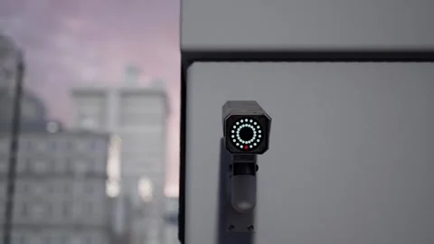 Outdoor CCTV Security Camera Mounted on Building Wall with Blurred City Video stock 331574190