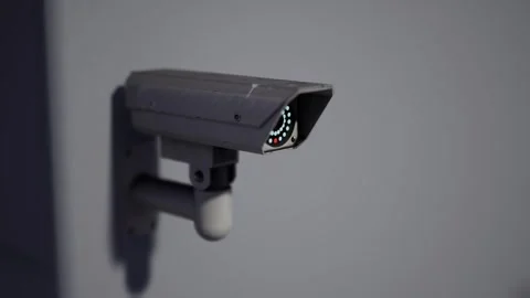 Outdoor CCTV Security Camera Mounted on Building Wall with Blurred City Video stock 331574278