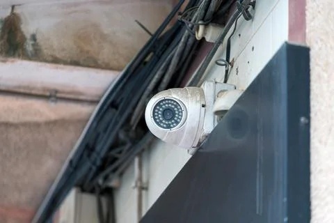 Outdoor CCTV security camera mounted on building wall Stock Photos