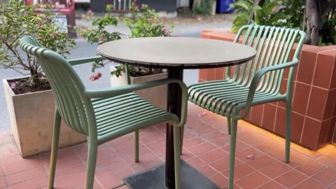 Outdoor chairs and table set on patio Stock Footage 312096377