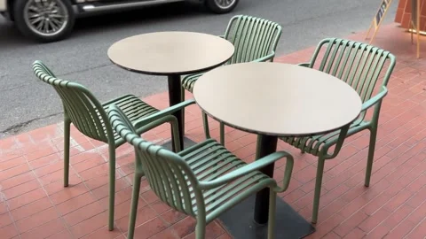 Outdoor chairs and table sets near a street Stock Footage 312096390