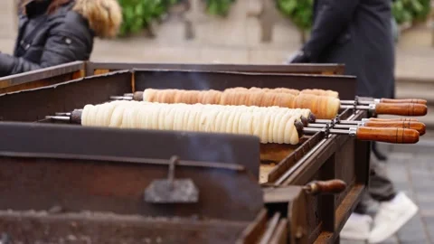 Outdoor Chimney Cakes Baking on Open Rollers at Street Stall Stock Footage 324942806