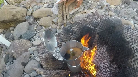 Outdoor coffie making on the fire Video stock 147987007