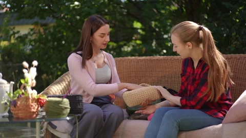 Outdoor Conversation and Interaction Between Two Young Women in a Colorful  Stock Footage 302191484