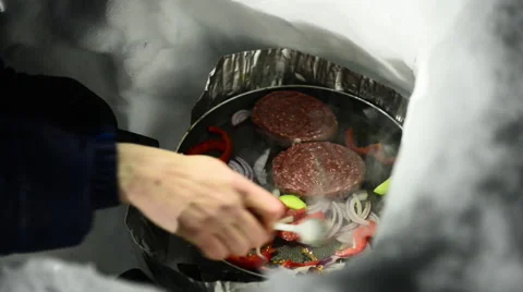 Outdoor cooking in the snow Stock Footage 60653901