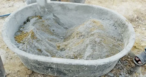 Outdoor culinary creativity mixing ingredients in a bathtub amid nature's beauty Stock Footage 332785377