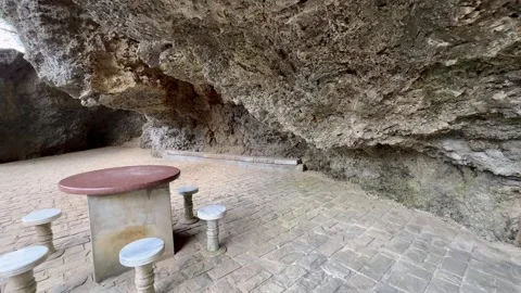 Outdoor dining area under cave. Wide angle motion shot, 4k Stock Footage 270156941