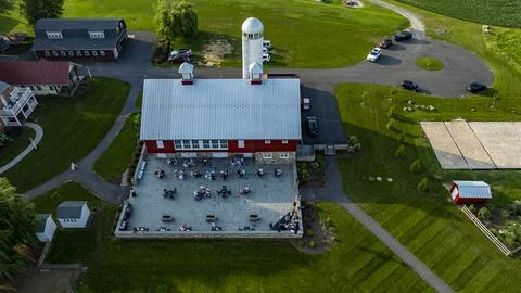 Outdoor Dining Experience at a Rustic Barn in a Serene Countryside Setting Stock Photos