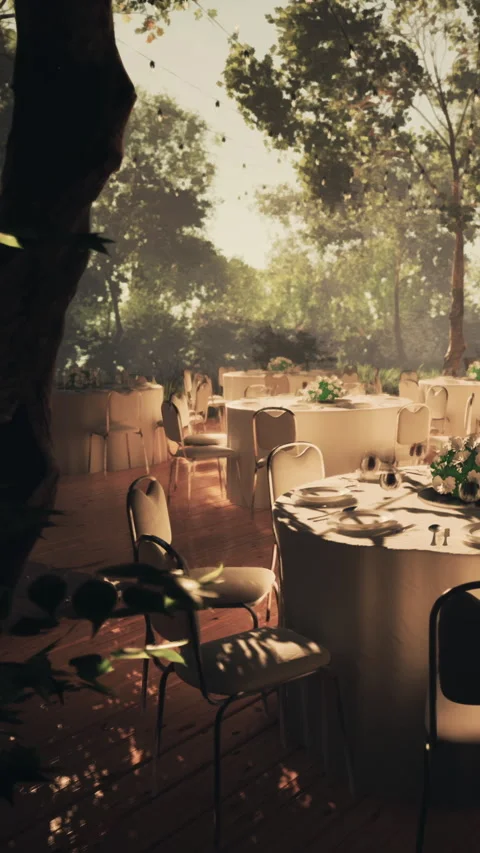 Outdoor dining setup for an event near a forest during the evening Stock Footage 337936424