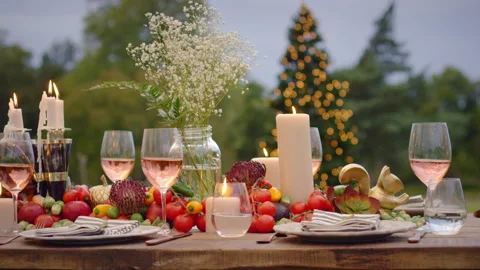 An outdoor dining table with elegant and festive table setting for the holidays, Video stock 140554214