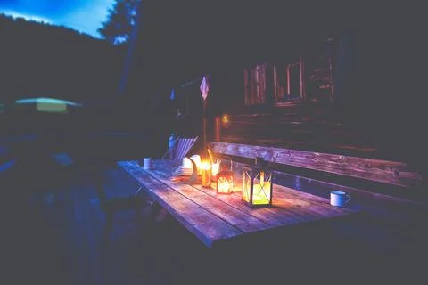 Outdoor dinner table in the dark Stock Photos