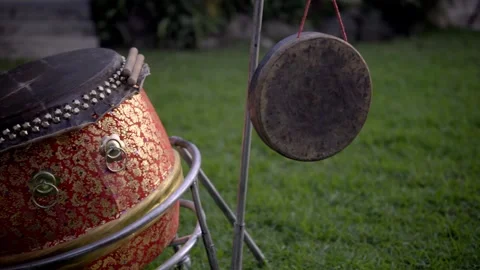 Outdoor Drum and Gong Set on Lush Grass, Evoking Peaceful Vibes Stock Footage 329277686