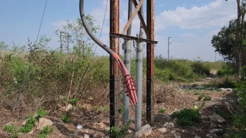 Outdoor electrical power line cable termination mounted on a metal support Stock-Footage 329561250