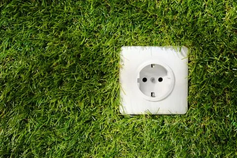 Outdoor electrical socket in green grass Stock Photos