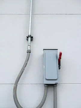 Outdoor Electrical Switch Box with Conduit and Wiring Stock Photos