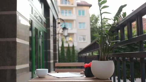 Outdoor empty workplace at terrace with table and laptop for working Stock Footage 114132722