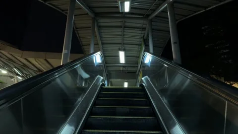 Outdoor Escalator moving staircase up to Elevated metro station at Night. Stock Footage 340180020