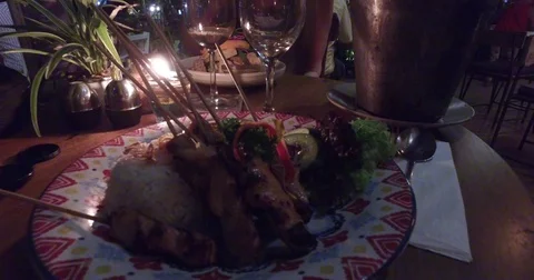 Outdoor evening romantic dinner - pours wine Stock Footage