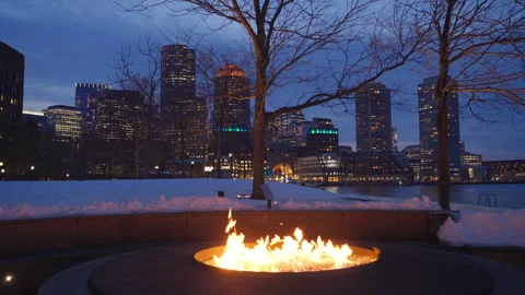 Outdoor fire pit burning bright on a winter night at Boston Fan Pier Park Vídeos de archivo 303487371