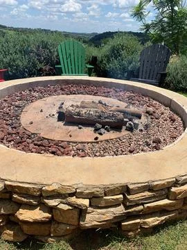 Outdoor fire pit with logs Stock Photos
