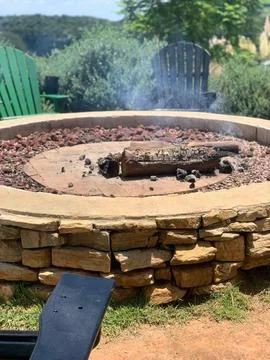 Outdoor fire pit in rustic setting Stock Photos