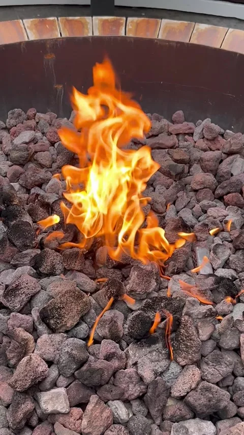 Outdoor fire pit at the terrace of a restaurant in ski resort Courchevel Stock Footage 337060951