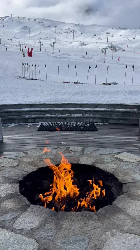 Outdoor fire pit at a  terrace in ski resort Courchevel Stock Footage 337227195