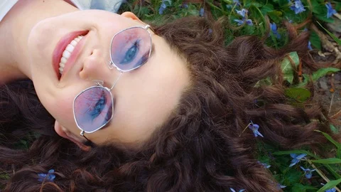 Outdoor flat lay, top view close up portrait of young beautiful happy smiling Stock Footage 111523103