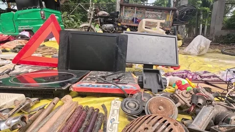 Outdoor flea market stall displaying used electronic equipment Stock Footage 346158982
