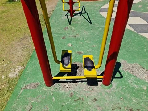 Outdoor Foot Swing Exercise Machine in Public Urban Park Gym Stock Photos