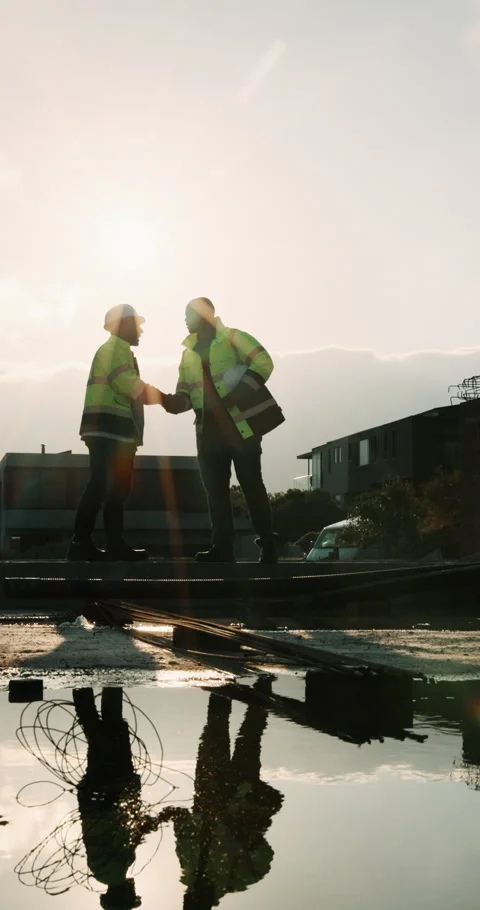 Outdoor, handshake and men on construction site for talking, planning and Stock Footage 336298084