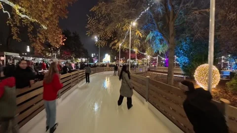Outdoor ice skating path at a Christmas market in Vienna. Stock Footage 323505652