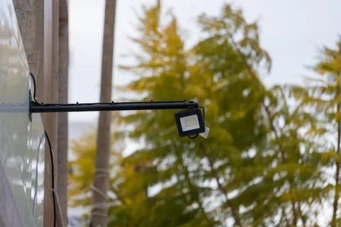 Outdoor LED security floodlight mounted on building wall Stock Photos