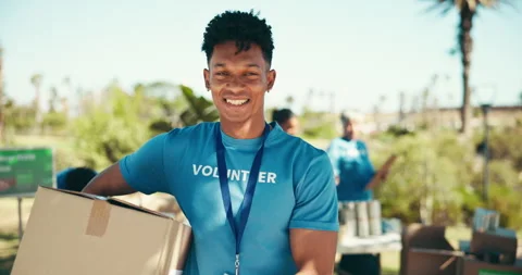 Outdoor, man and face with box for volunteering, community service and Stock Footage 294550790