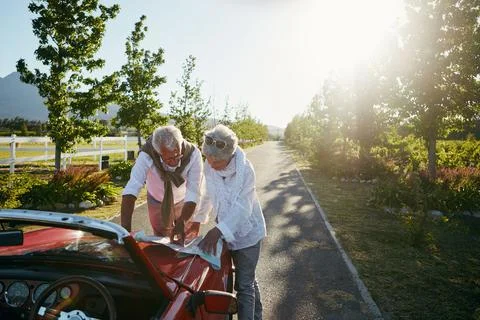 Outdoor, map or elderly couple by car for road trip, holiday travel or dest.. Fotos Stock