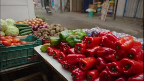 Outdoor Market Scene Vibrant: featuring red &amp; green Peppers. Stock Footage 301276853