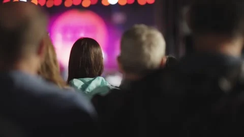 Outdoor Music Performance Crowd at Night with Vibrant Stage Lights Stock Footage 339751467
