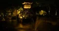 Outdoor nightshot Bali garden pond fountain with tower building 4k or 4k+ Resolution