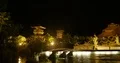 Outdoor nightshot Bali garden pond fountain with sculptures and building 4k or 4k+ Resolution